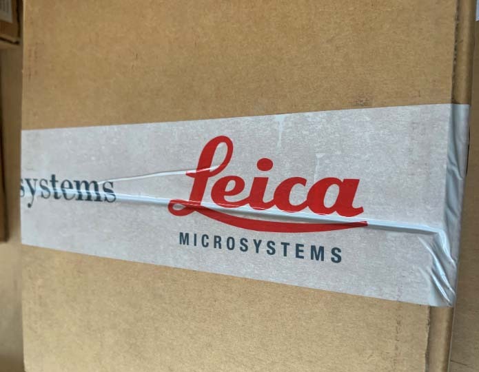 Photo Used LEICA Lot of spare parts for microscope For Sale