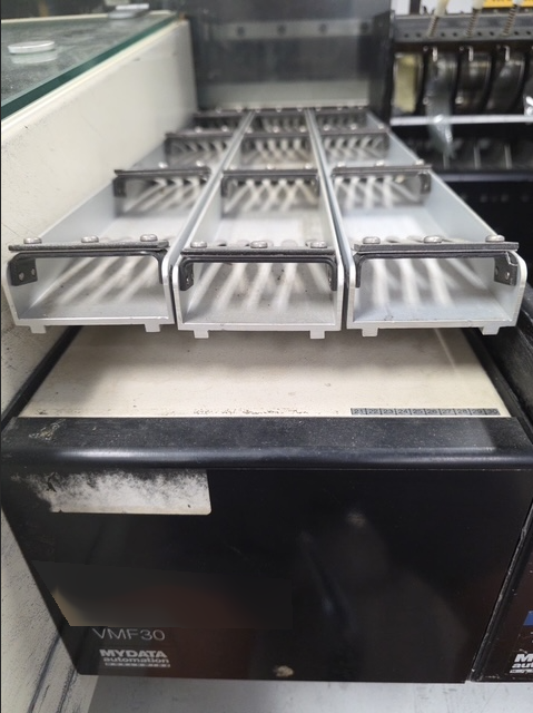 Photo Used MYDATA Lot of feeders For Sale